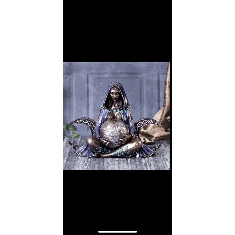 Mother earth resin Statue. Two crescent moons on either side. So pretty .